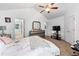 This is a lovely bedroom with vaulted ceilings, carpeted floors, and white paint at 248 Springbottom Dr, Lawrenceville, GA 30046