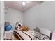 A small bedroom with a twin sized bed and unique ceiling fan at 248 Springbottom Dr, Lawrenceville, GA 30046