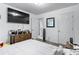 This bedroom has a modern look with a large TV and clean white walls at 248 Springbottom Dr, Lawrenceville, GA 30046