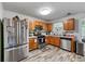 Traditional kitchen featuring stainless steel appliances and light-colored wood cabinets at 248 Springbottom Dr, Lawrenceville, GA 30046