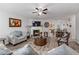 Bright and airy living room featuring hardwood floors, a fireplace, comfortable seating, and an open layout at 248 Springbottom Dr, Lawrenceville, GA 30046