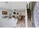 Inviting living room with hardwood floors, a cozy fireplace, comfortable seating, and open access to the kitchen at 248 Springbottom Dr, Lawrenceville, GA 30046