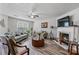 Cozy living room boasting hardwood floors, a fireplace, comfortable sofas, and stylish decor for a relaxing ambiance at 248 Springbottom Dr, Lawrenceville, GA 30046