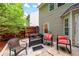The home has a beautiful patio with red cushions on the outdoor chairs at 248 Springbottom Dr, Lawrenceville, GA 30046