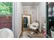 This in-home salon features a chair, mirror and space for beautification at 248 Springbottom Dr, Lawrenceville, GA 30046