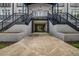 View of the entrance to the building with dual staircases and covered drive through area at 502 Sw Pryor Sw St # 325, Atlanta, GA 30312