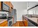 Kitchen featuring stainless steel appliances, wood cabinets, and a sink with grey countertop at 502 Sw Pryor Sw St # 325, Atlanta, GA 30312