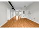 Large living room with hardwood floors, white walls, and open concept design into other rooms at 502 Sw Pryor Sw St # 325, Atlanta, GA 30312