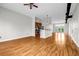 Open living space with hardwood floors, modern ceiling fan, and stainless steel appliances at 502 Sw Pryor Sw St # 325, Atlanta, GA 30312