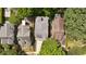 Overhead view of a modern house showcasing its roof, driveway, and lush green surroundings at 555 Orme Ne Cir, Atlanta, GA 30306