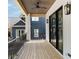 Inviting balcony with wood floors, wood ceiling and black metal railings offering outdoor living space at 555 Orme Ne Cir, Atlanta, GA 30306