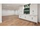 Finished basement with built-in bar area, featuring stylish cabinetry and decorative backsplash at 555 Orme Ne Cir, Atlanta, GA 30306