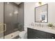 Modern bathroom features a glass enclosed shower and sleek vanity with marble countertop at 555 Orme Ne Cir, Atlanta, GA 30306