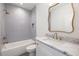 Bright bathroom with tub-shower combination, and vanity with marble countertop at 555 Orme Ne Cir, Atlanta, GA 30306