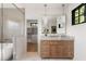 Bathroom with tub, walk in shower, natural stone counters, and walk-in closet access at 555 Orme Ne Cir, Atlanta, GA 30306