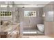 Beautiful bathroom features a glass-enclosed shower, soaking tub, and double sink vanity at 555 Orme Ne Cir, Atlanta, GA 30306