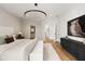 Spacious bedroom boasts wood floors, a walk-in closet, and a contemporary black media center at 555 Orme Ne Cir, Atlanta, GA 30306