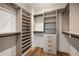 Well-organized walk-in closet with custom shelving, drawers, and ample storage space at 555 Orme Ne Cir, Atlanta, GA 30306