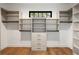 Spacious walk-in closet with built-in shelving and drawers, offering ample storage solutions at 555 Orme Ne Cir, Atlanta, GA 30306