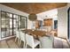 Dining room featuring designer light fixture, adjacent to kitchen and living area at 555 Orme Ne Cir, Atlanta, GA 30306