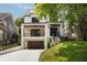 Stunning two-story home featuring a modern design, beautiful landscaping, and an integrated garage at 555 Orme Ne Cir, Atlanta, GA 30306