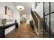 Elegant foyer featuring herringbone floors, modern lighting, and a staircase to the second floor at 555 Orme Ne Cir, Atlanta, GA 30306