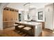 Spacious kitchen featuring an island with seating, custom cabinets and modern lighting at 555 Orme Ne Cir, Atlanta, GA 30306
