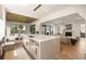 Open concept kitchen featuring a large island, dining area, and living room at 555 Orme Ne Cir, Atlanta, GA 30306