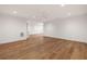 Open living room with hardwood floors, white walls and trim, and recessed lighting at 555 Orme Ne Cir, Atlanta, GA 30306