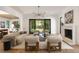 Bright, open living room with modern furnishings, fireplace and seamless flow to the outdoor space at 555 Orme Ne Cir, Atlanta, GA 30306
