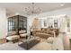 Open-concept living room with modern decor, light hardwood floors, and stylish lighting fixtures at 555 Orme Ne Cir, Atlanta, GA 30306