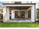 Covered patio featuring an outdoor fireplace, slate floors and modern lighting and fan at 555 Orme Ne Cir, Atlanta, GA 30306