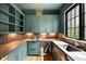 Butler's pantry with custom cabinets, wine cooler, and stylish backsplash at 555 Orme Ne Cir, Atlanta, GA 30306