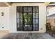 Spacious patio featuring stone floors and a grand glass door offering natural light and elegance at 555 Orme Ne Cir, Atlanta, GA 30306