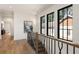 Staircase with black metal railing and oversized windows at 555 Orme Ne Cir, Atlanta, GA 30306