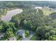 Scenic aerial view of a property with lush greenery and a nearby lake at 600 River Bend Sw Cir, Smyrna, GA 30082