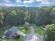 Aerial view of the property in a neighborhood showcasing mature trees and well-maintained yards at 600 River Bend Sw Cir, Smyrna, GA 30082