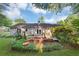 Lush backyard featuring a deck, brick accents, and beautiful landscaping at 600 River Bend Sw Cir, Smyrna, GA 30082
