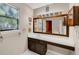 Bathroom with long vanity counter, cabinet space, large mirror, and creative sunflower decorations at 600 River Bend Sw Cir, Smyrna, GA 30082
