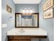 Bathroom vanity with large mirror, vanity lighting and medicine cabinet at 600 River Bend Sw Cir, Smyrna, GA 30082