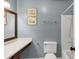 Bathroom with a large mirror, vanity, and tub with shower at 600 River Bend Sw Cir, Smyrna, GA 30082
