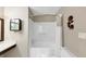 Bathroom featuring a bathtub, shower with a curtain, and a decorative sunflower wall fixture at 600 River Bend Sw Cir, Smyrna, GA 30082