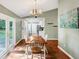 Bright dining area adjacent to the kitchen, featuring a wooden table, and access to the backyard at 600 River Bend Sw Cir, Smyrna, GA 30082