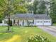 Charming single-story home with a well-manicured lawn, classic design, and an attached two-car garage at 600 River Bend Sw Cir, Smyrna, GA 30082