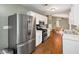 Open kitchen with stainless steel appliances and eat-in dining area at 600 River Bend Sw Cir, Smyrna, GA 30082