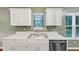 The kitchen features a double sink, stainless steel appliances and lots of natural light at 600 River Bend Sw Cir, Smyrna, GA 30082