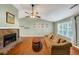 Spacious living room with a vaulted ceiling, stone fireplace, and natural lighting from a large window at 600 River Bend Sw Cir, Smyrna, GA 30082