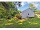 Home's yard features a stone path, wood deck and privacy at 600 River Bend Sw Cir, Smyrna, GA 30082
