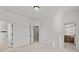 Bright bedroom with neutral carpet with an open closet and an open doorway at 1345 Hilltop Overlook Dr, Marietta, GA 30062
