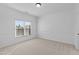 Bright bedroom featuring neutral carpet, a large window and white walls at 1345 Hilltop Overlook Dr, Marietta, GA 30062